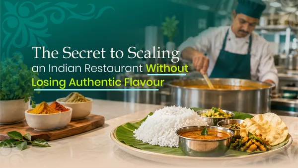 Restaurant chef preparing traditional Indian dishes with spices in a professional kitchen.